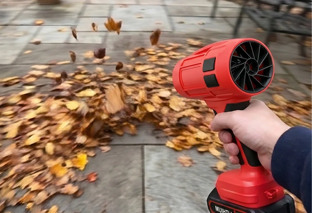 The Wood Ranger Leaf Blower clearing autumn leaves from a patio